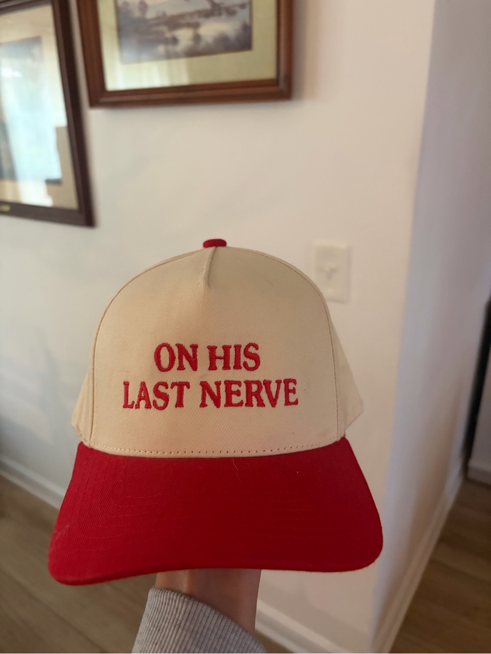 CC hat embroidered Beige and Red "ON HIS LAST NERVE" Trucker Hat